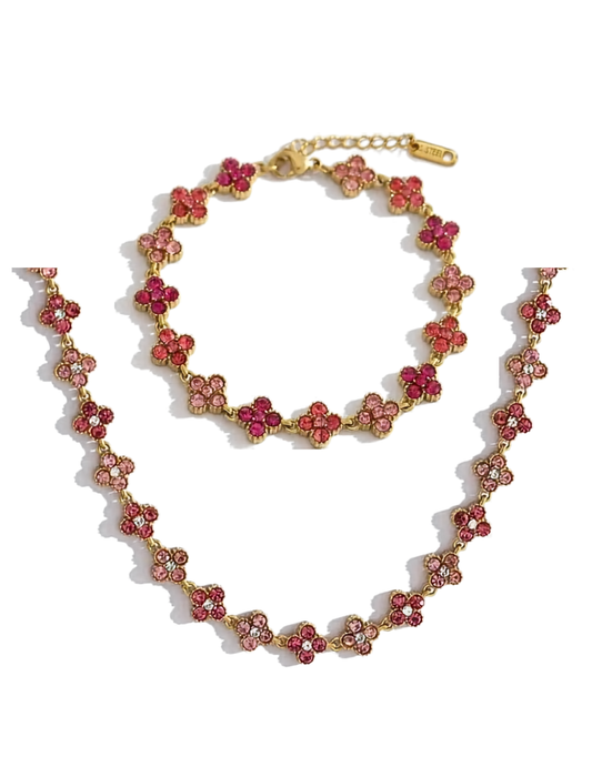 PINK FLORAL GOLD PLATED NECKLACE AND BRACELET ON WHITE BACKGROUND