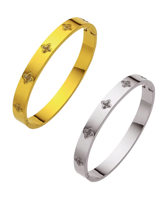GOLD PLATED BANGLE AND SILVER BANGLE ON WHITE BACKGROUND