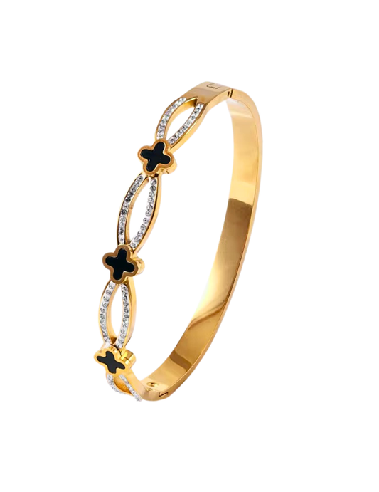 GOLD PLATED CLOVER BANGLE WITH ZICRON STONES ON WHITE BACKGROUND