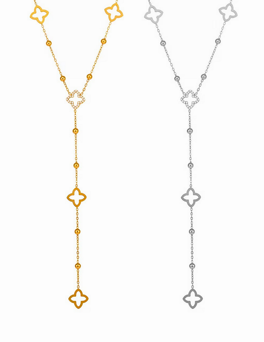GOLD PLATED AND SILVER CLOVER NECKLACE ON WHITE BACKGROUND