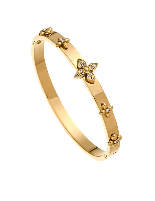 FLORAL GOLD PLATED BANGLE ON WHITE BACKGROUND