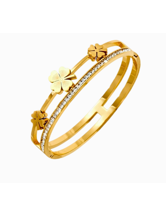 GOLD PLATED FLORAL BANGLE WITH ZICRON STONES ON WHITE BACKGROUND