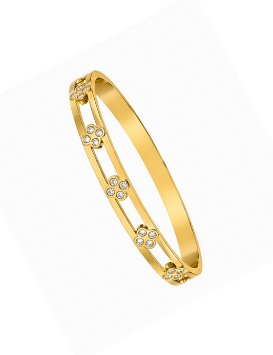CLOVER GOLD PLATED BANGLE ON WHITE BACKGROUND