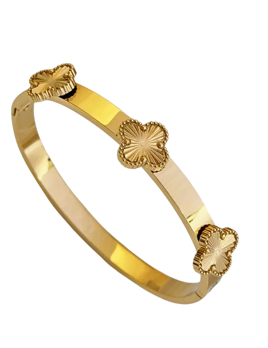 gold clover bangle on white background