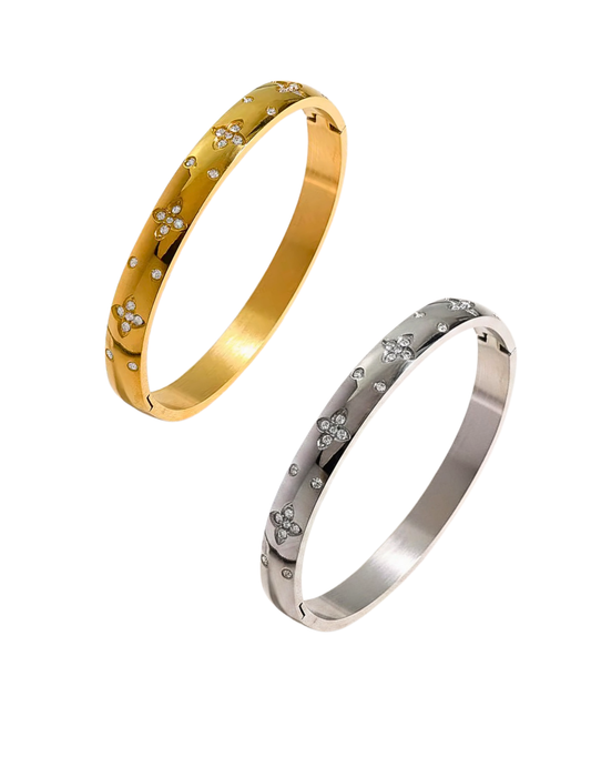 two floral clover bangles on white background