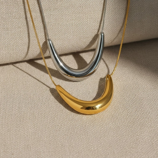 “Bella Luce 18k gold-plated stainless steel necklace—44.5 + 5 cm adjustable, waterproof, tarnish-free, hypoallergenic—on neutral background.”

